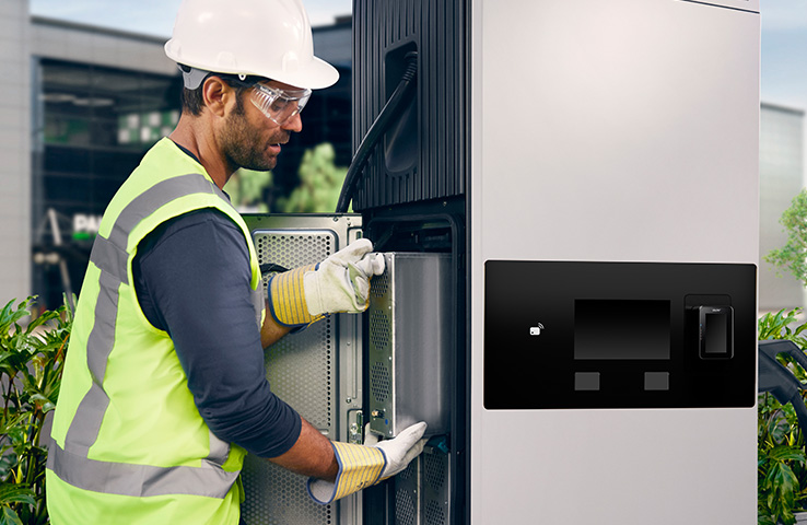 Electrician removing power module for maintenance